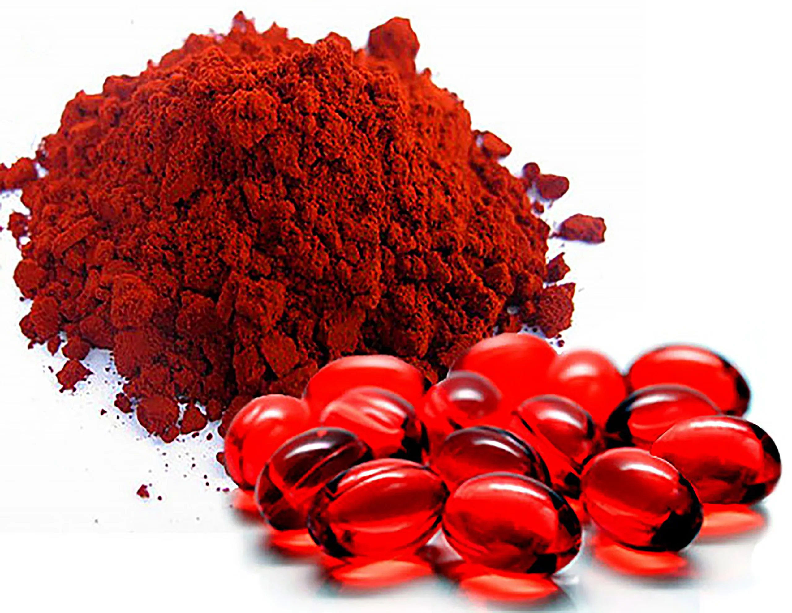 A pile of red capsules rich in astaxanthin, offering health benefits.