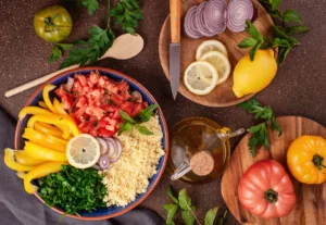A bowl of couscous and vegetables on a table.