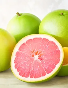 Grapefruits and oranges on a white background.