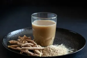 Ashwagandha extract bottle surrounded by leaves