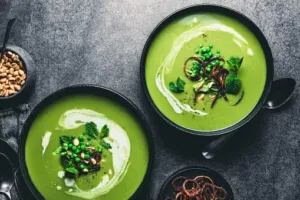 Fresh mint leaves in a bowl, showcasing the vibrant green color and aromatic essence of mint flavor.