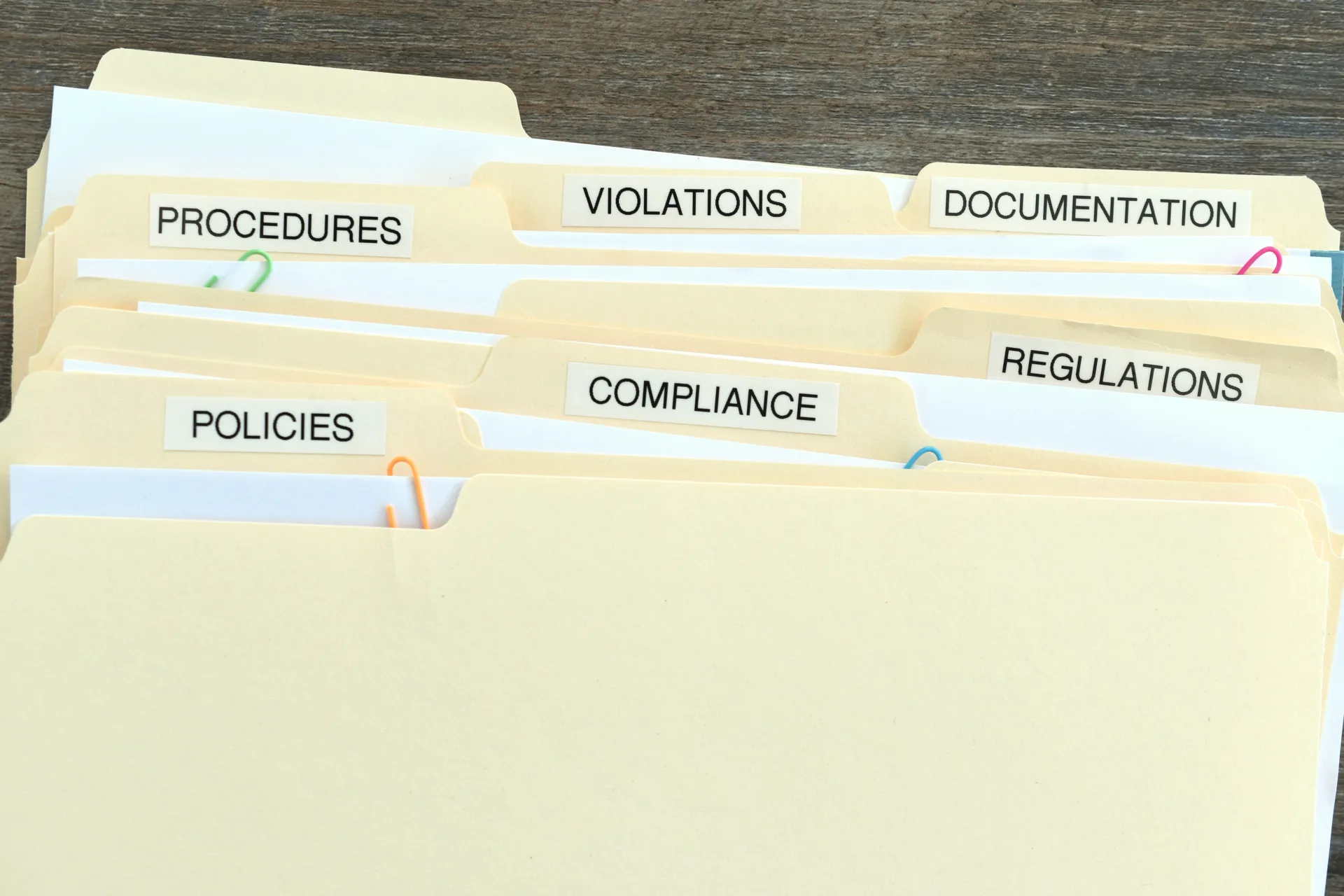 Organized office files labeled with various categories.