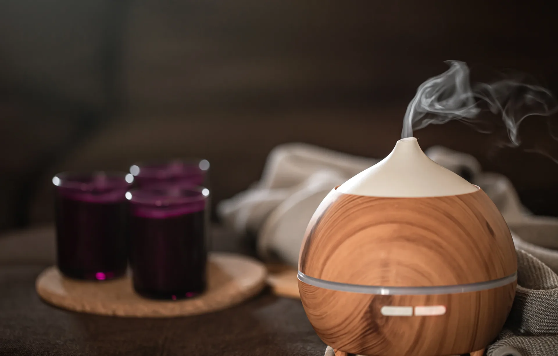 Aromatic diffuser with steam near candles.
