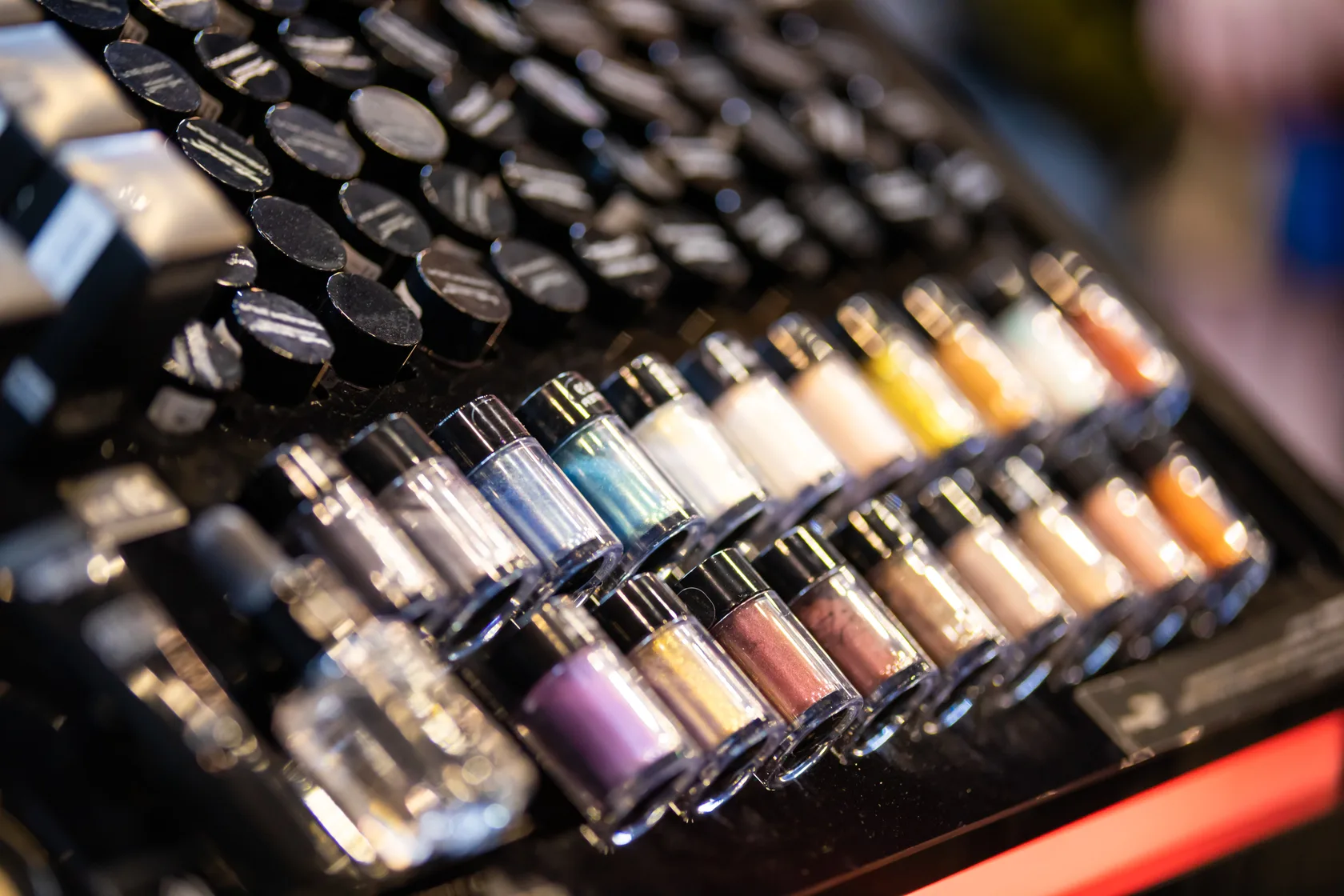 Colorful eyeshadow display at a cosmetics store.