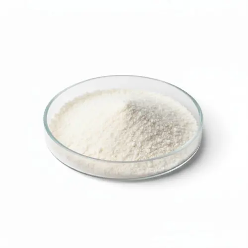 White powder in a glass dish on white background.