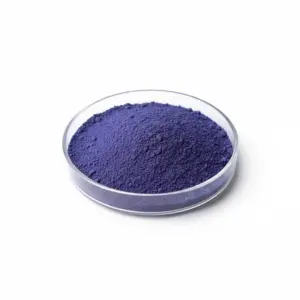 Bowl of purple pigment powder on white background.