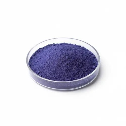 Bowl of purple pigment powder on white background.