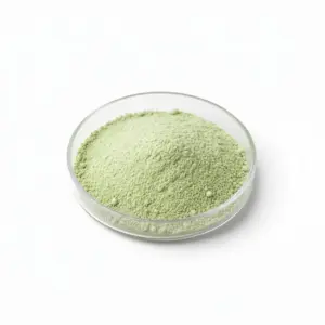 Green powder in a glass dish for research.