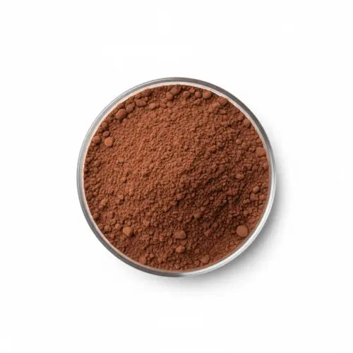 Bowl of cocoa powder on white background.