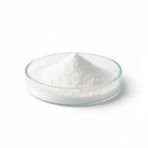 White powder in glass dish on white background.