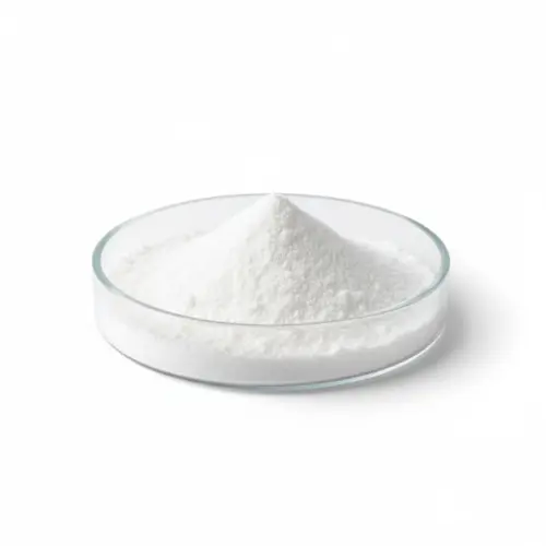 White powder in glass dish on white background.