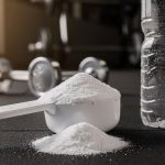 Workout supplements and water bottle at gym