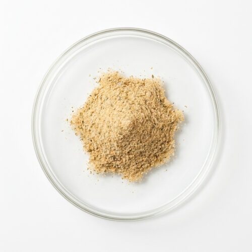 chicken-seasoning-powder Tan beige chicken seasoning flavor powder in a glass petri dish