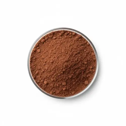 cocoa-powder-flavanol Brown cocoa powder in a glass petri dish