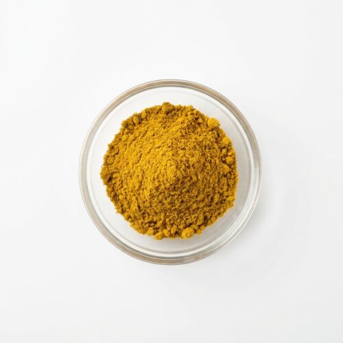 curcumin-powder-extract Vivid orange curcumin powder extract in a glass petri dish