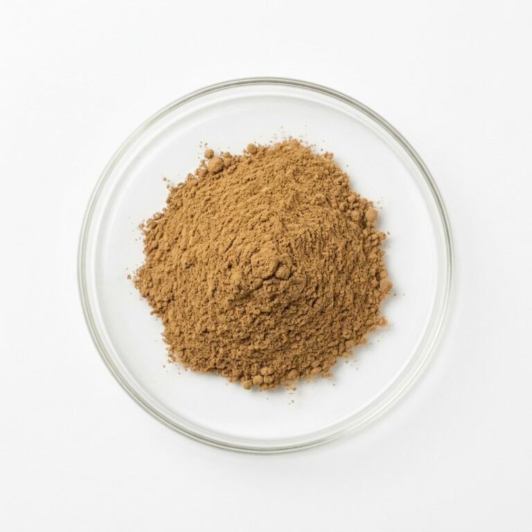 Tan flaxseed oil powder in a glass petri dish