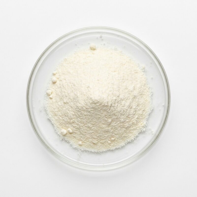 goat-milk-powder Fine white goat milk powder in a glass petri dish