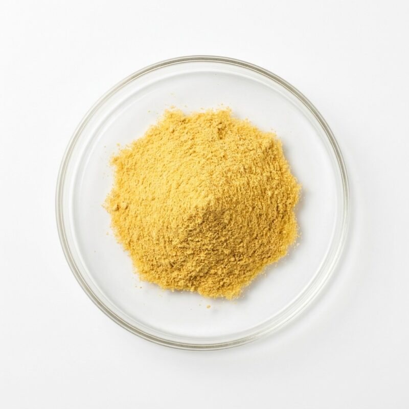 PSD Pineapple - Natural Pineapple Juice Powder Golden yellow pineapple juice powder in a glass petri dish