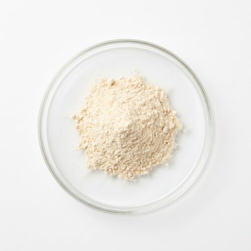 PSD Vanilla - Natural Vanilla Flavor Powder Creamy beige vanilla flavor powder in a glass petri dish