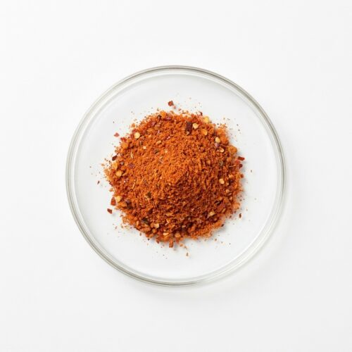 kimchi-seasoning-powder Red kimchi seasoning spice powder blend in a glass petri dish