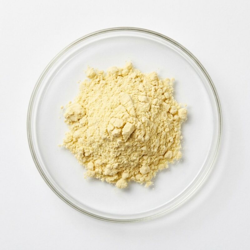 lemon-psd-spray-dried Pale yellow lemon PSD juice powder in a glass petri dish