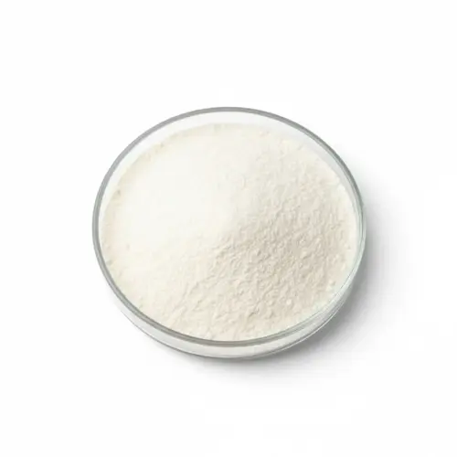 non-dairy-creamer-beverage-whitener White non-dairy creamer powder in a glass petri dish
