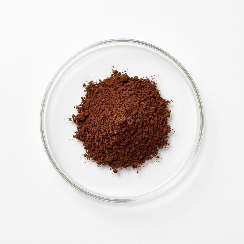 reishi-mushroom-extract-powder Dark reddish-brown reishi mushroom extract powder in a glass petri dish