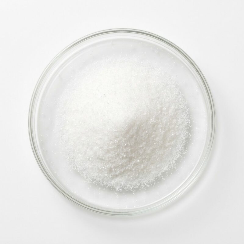 sucralose-powder Fine white crystalline sucralose sweetener powder in a glass petri dish